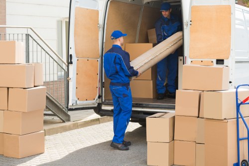 Professional removals and storage service in Swisscottage with packed moving boxes