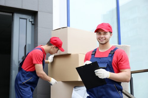 Moving team handling house removals in Swisscottage on a residential street