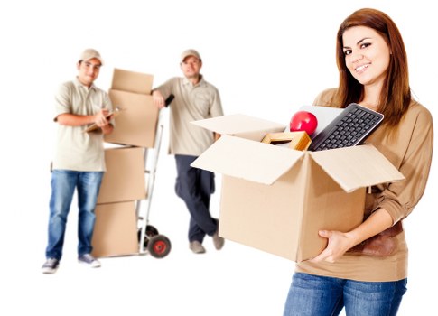 Careful packing of household items for house removals in Swisscottage