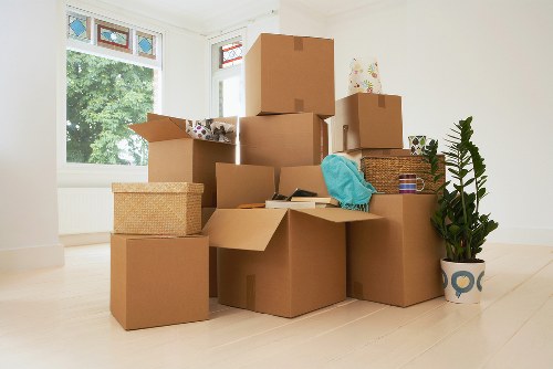 Packing boxes into a mobile storage unit in Swisscottage