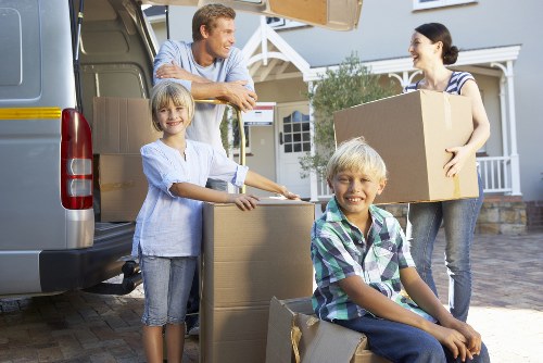 Packed boxes and furniture prepared for removals in Swisscottage