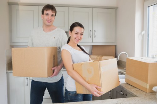 Household moving team handling furniture during Swisscottage removals
